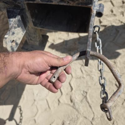 Integrated Fork Guide 9 | ManBaskets.ca Bent mild-steel rod pin from competitor manbasket showing failure of weak retention system.