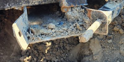 Integrated Fork Guide 6 | ManBaskets.ca Damaged competitor fork pocket with broken flat bar guide and bent retaining pin showing complete safety failure.