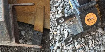 Competitor telehandler manbasket fork pockets with flat bar guides showing bending, cracking, and unsafe OSHA-marked design failing proper Fork Pocket Safety.