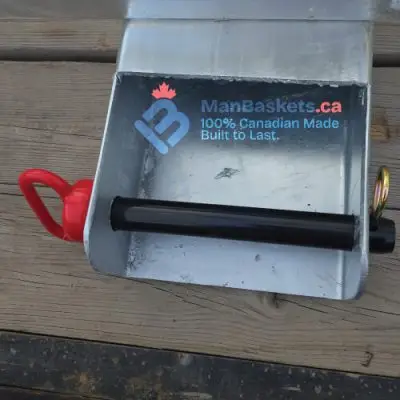 Canadian-made Integrated Fork Guide interior showing welded guide channel and engineered retaining pin for telehandler jib safety.