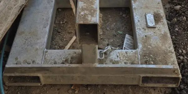 Telehandler manbasket fork pocket with no guide system showing unsafe open design and high risk of disengagement.